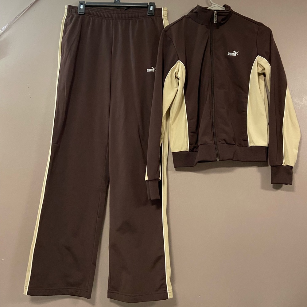 brown puma track suit top is a small pants are a medium